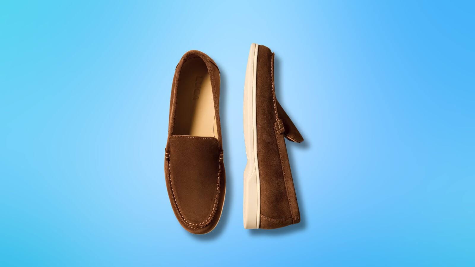 pair of stylish brown suede loafers set against a blue background