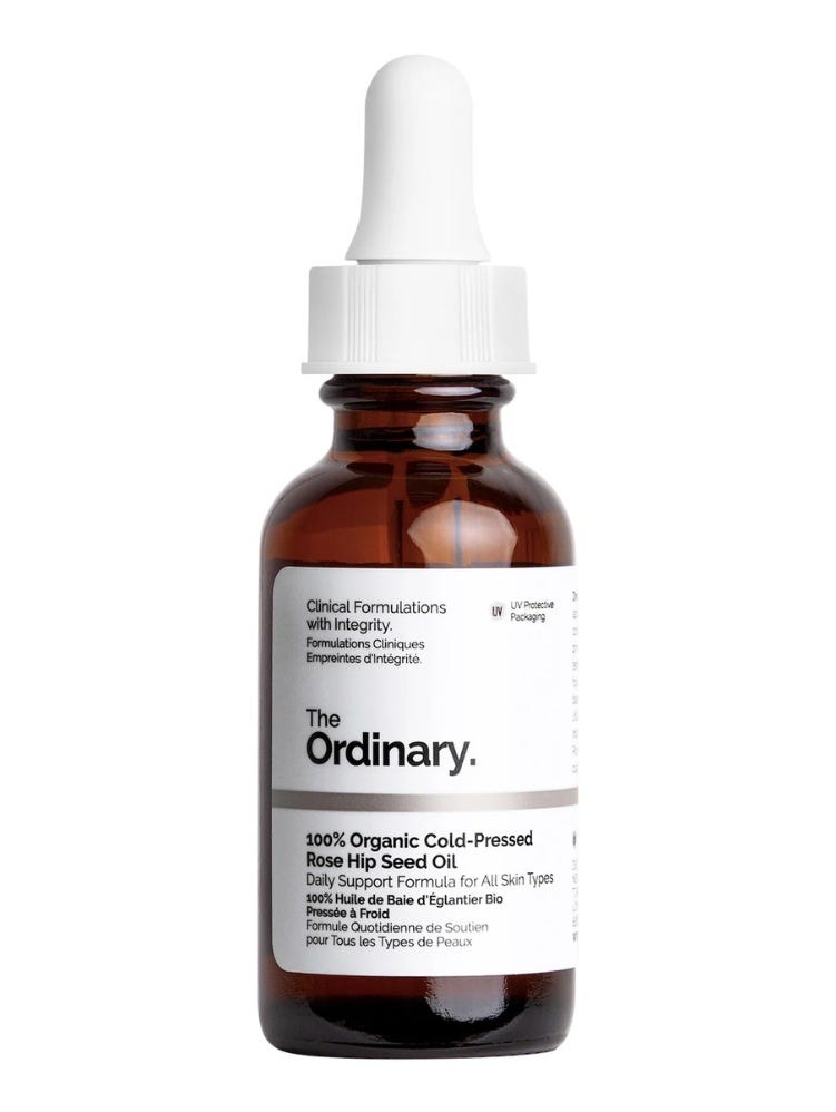 bottle of face oil with a white label
